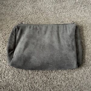 Ah-dorned faux suede makeup bag clutch